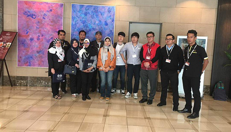 [speakers on conference stage]